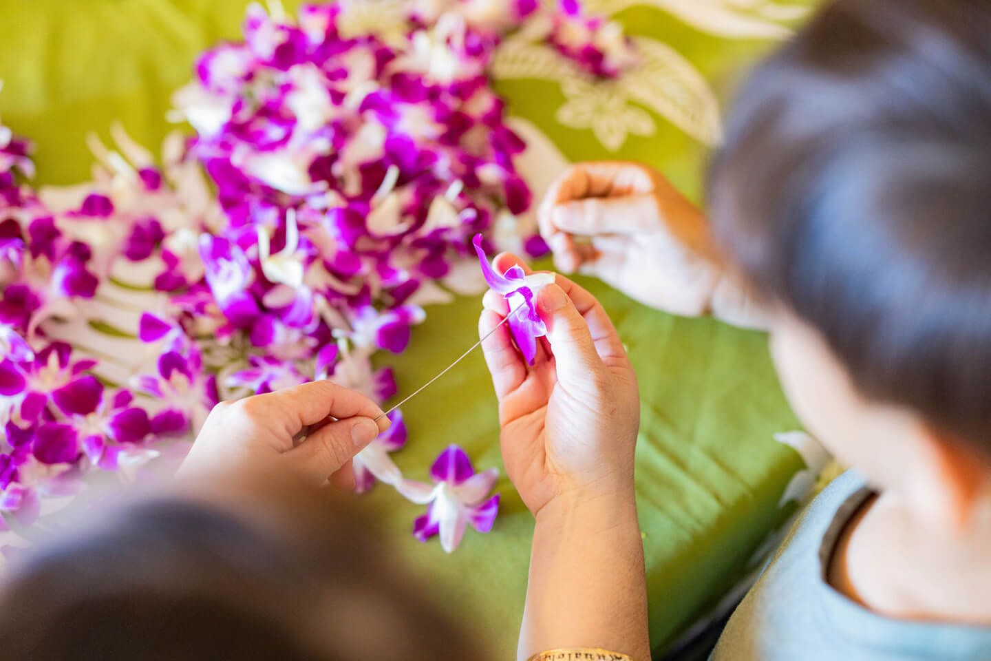 Orchids sewn into lei.