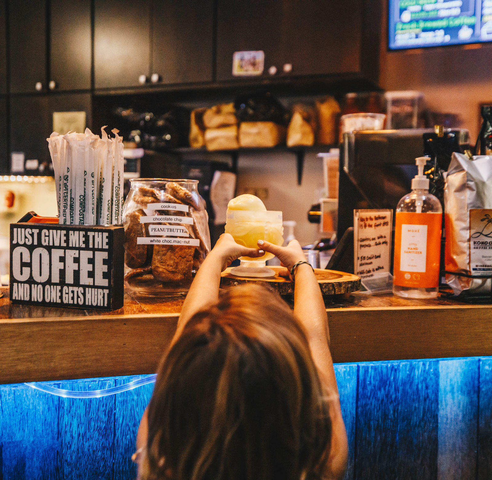 Banyan Breeze Coffee Shop Counter with youngster getting treat from the counter